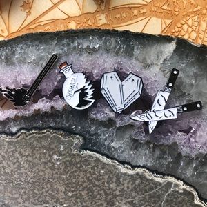 Set of four enamel pins